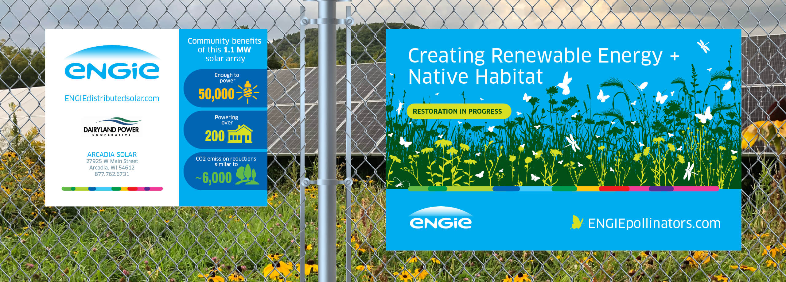 Two ENGIE solar site signs on a chain link fence surrounding a solar site with pollinator friendly plantings