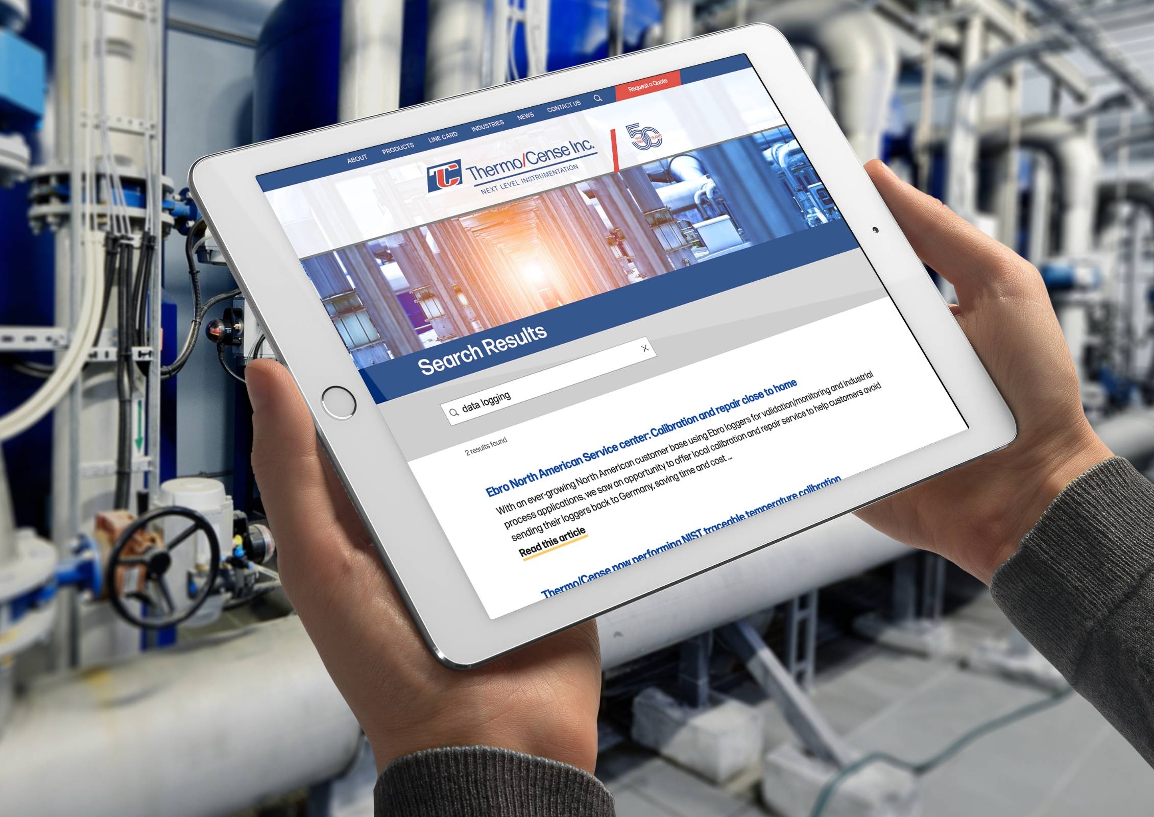 Man in front of HVAC equipment holding an ipad displaying Thermo/Cense search results page 