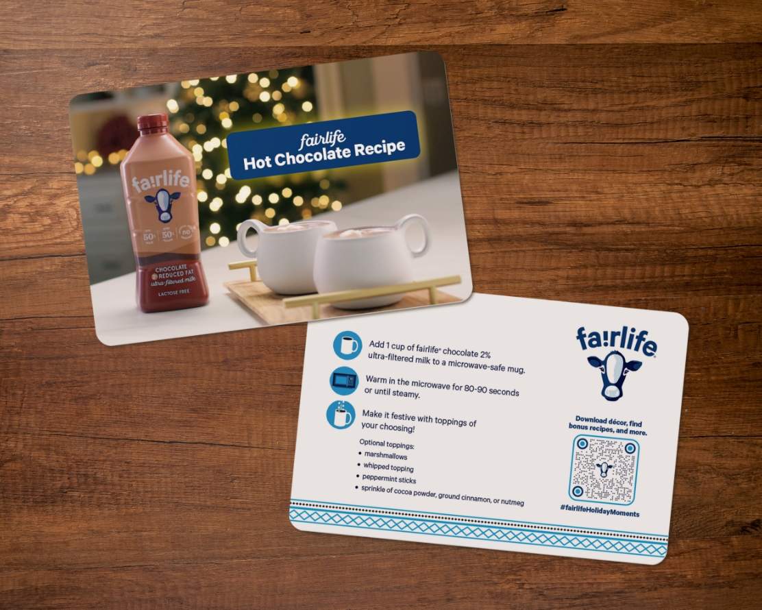 fairlife holiday hot chocolate kit recipe card front and back on a wooden table top