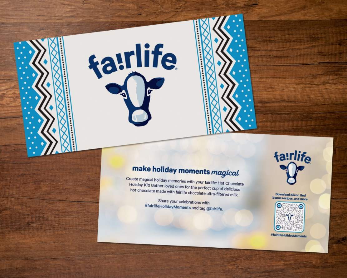 fairlife holiday promotional kit welcome card front and back on a wooden table top 